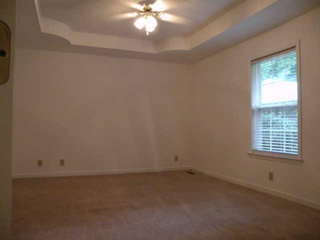 4754 Campbell Road Cross Plains, TN 37049 - Photo 15 of 20 an empty room with windows and chandelier fan