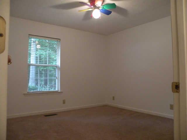 4754 Campbell Road Cross Plains, TN 37049 - Photo 18 of 20 an empty room with a window and a fan