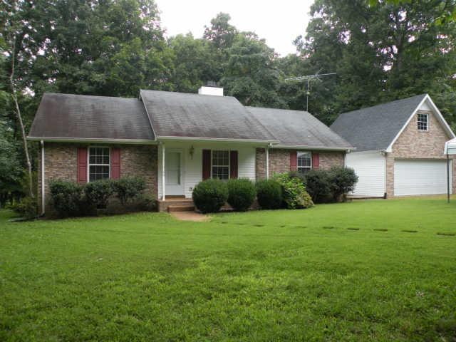 4754 Campbell Road Cross Plains, TN 37049 - Photo 2 of 20 a front view of a house with a yard and trees