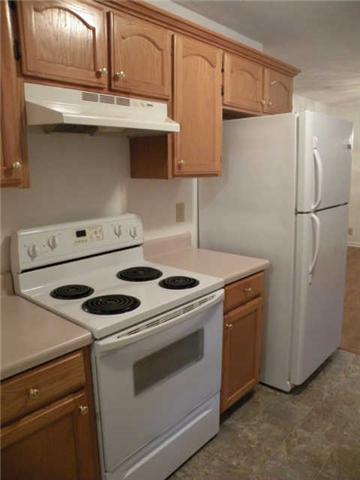 4754 Campbell Road Cross Plains, TN 37049 - Photo 10 of 20 a kitchen with a stove and a refrigerator