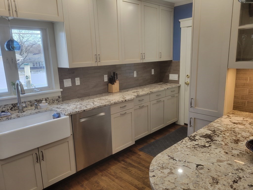 970 Pleasant Street Worcester, MA 01602 - Photo 11 of 39 a kitchen with a sink and cabinets