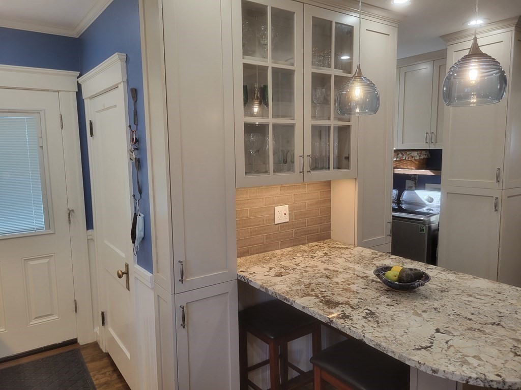 970 Pleasant Street Worcester, MA 01602 - Photo 16 of 39 a kitchen with a sink and cabinets