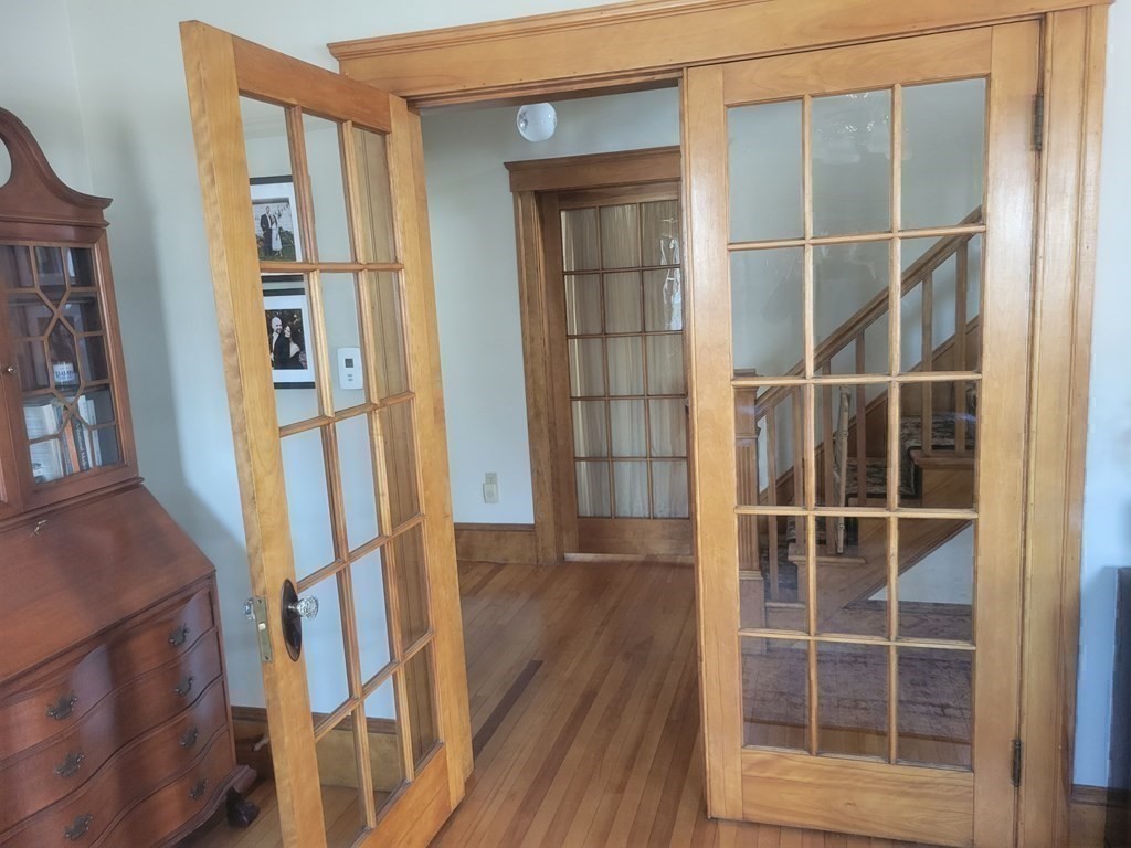 970 Pleasant Street Worcester, MA 01602 - Photo 27 of 39 a view of an entryway with wooden floor and door