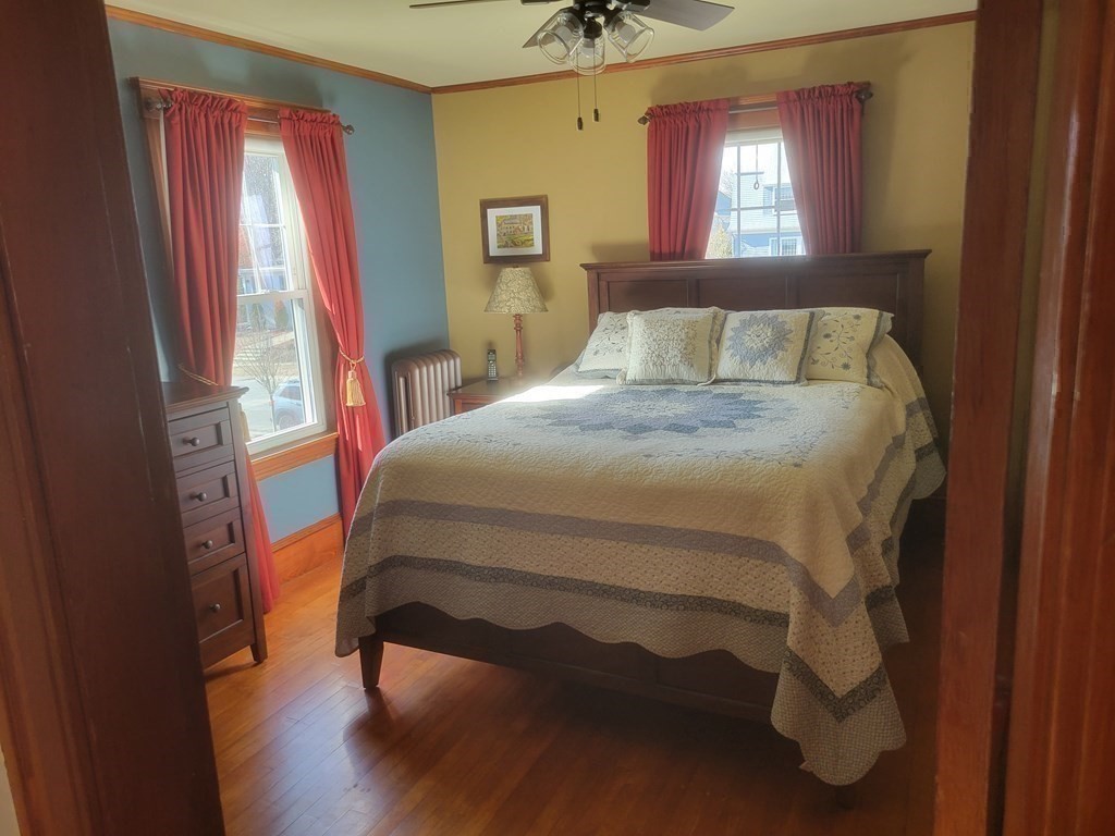 970 Pleasant Street Worcester, MA 01602 - Photo 31 of 39 a bedroom with a bed and window