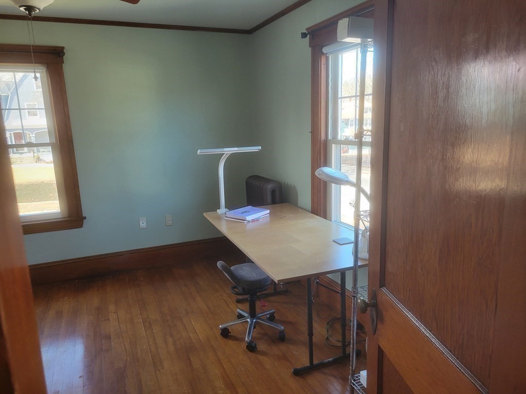 970 Pleasant Street Worcester, MA 01602 - Photo 33 of 39 a view of a workspace with furniture and a window