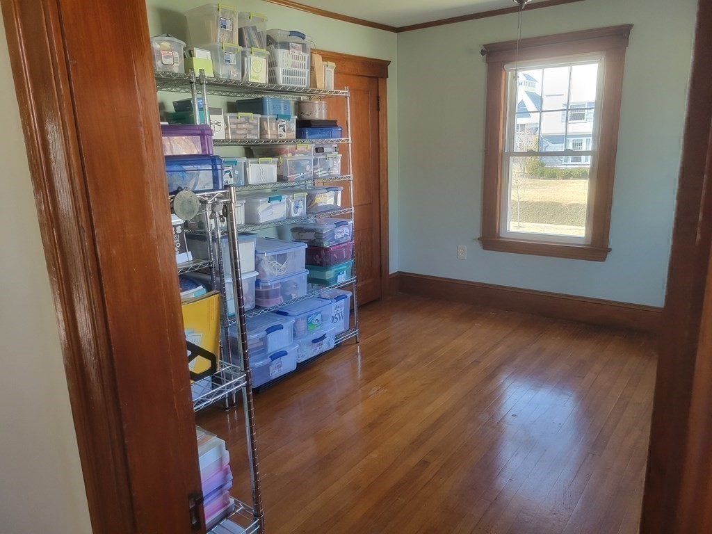 970 Pleasant Street Worcester, MA 01602 - Photo 34 of 39 a room with wooden floor and a window