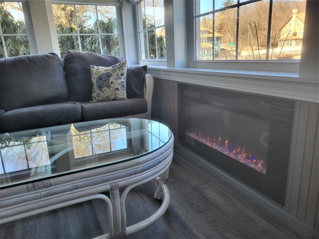 970 Pleasant Street Worcester, MA 01602 - Photo 6 of 39 a living room with furniture and a floor to ceiling window