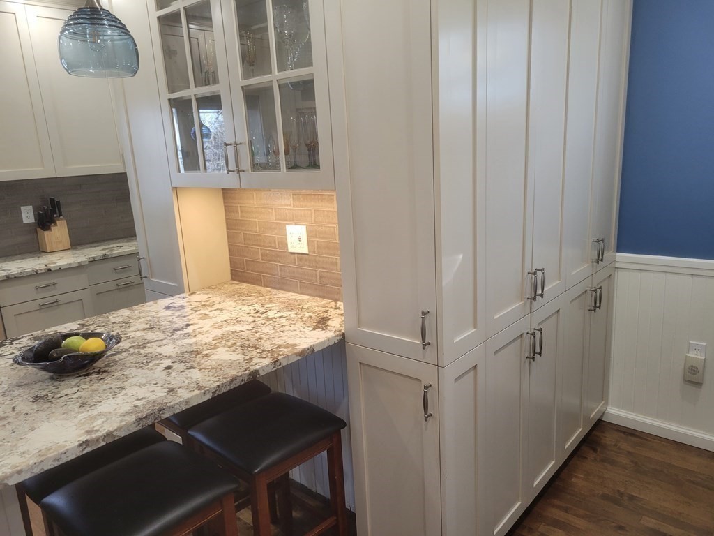 970 Pleasant Street Worcester, MA 01602 - Photo 10 of 39 a bathroom with a granite countertop sink and a mirror