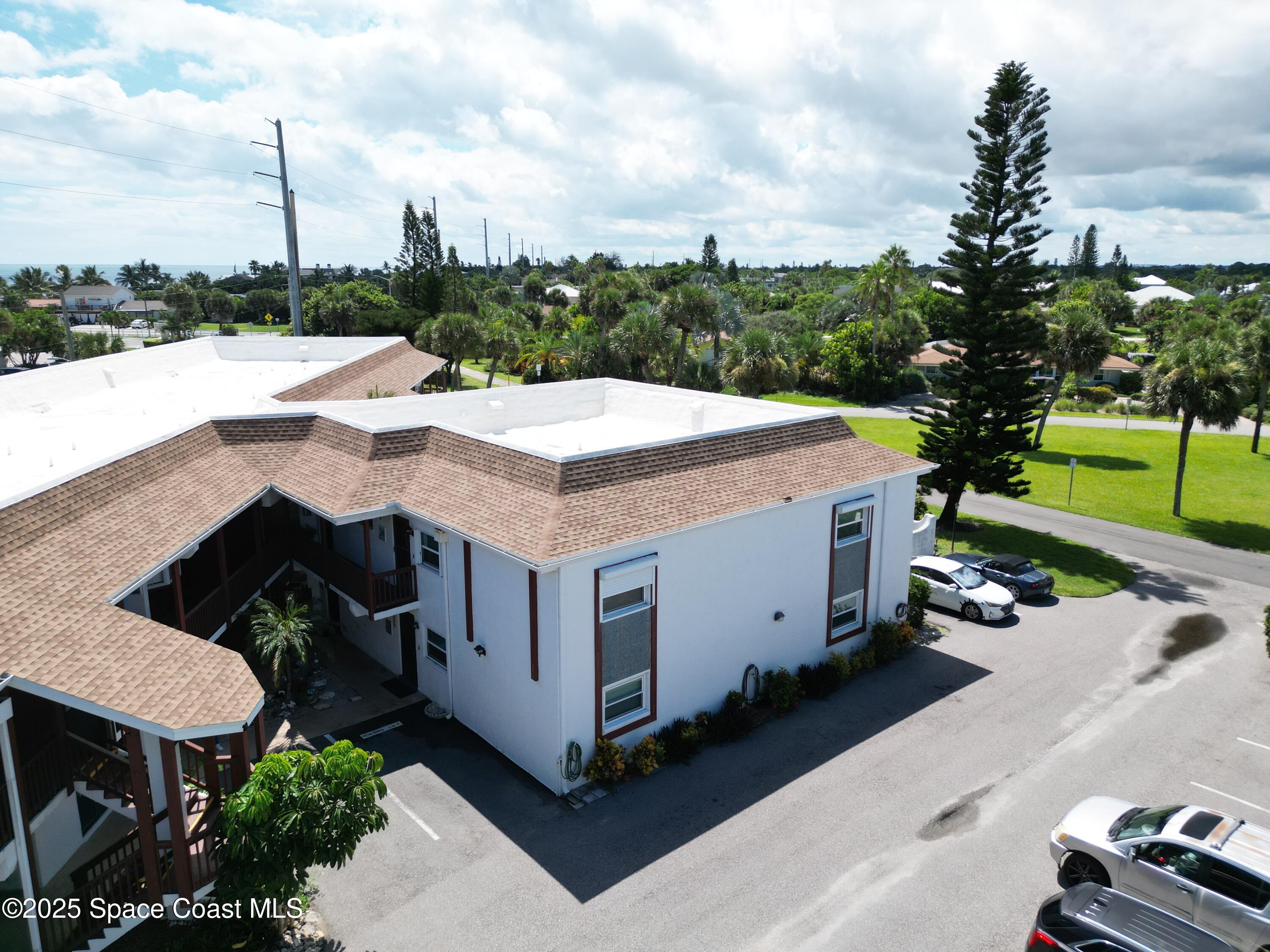 1318 South Miramar Avenue, Unit 208 Indialantic, FL 32903 - Photo 19 of 20 a view of a terrace with a yard