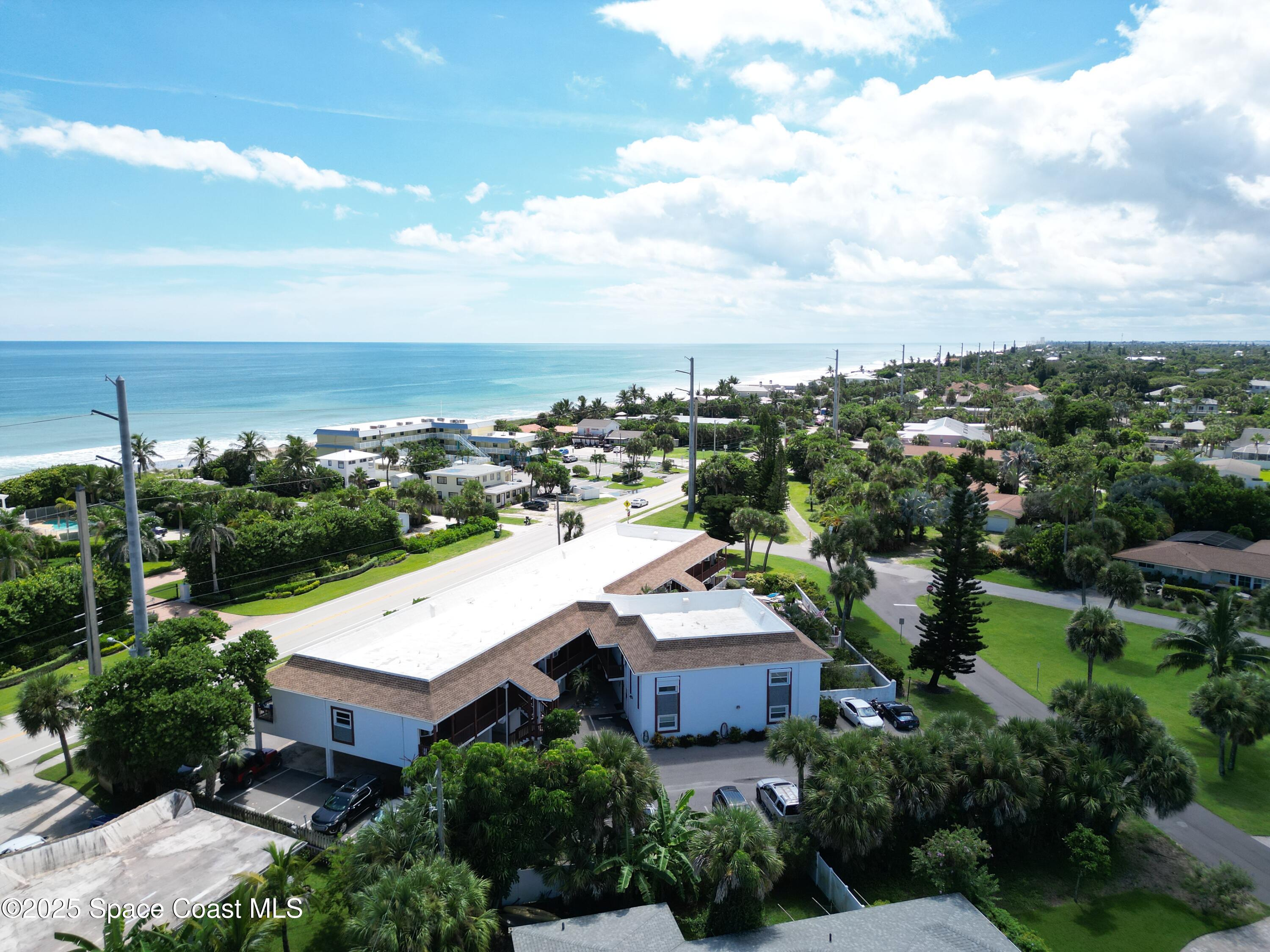 1318 South Miramar Avenue, Unit 208 Indialantic, FL 32903 - Photo 20 of 20 an aerial view of a house with a garden