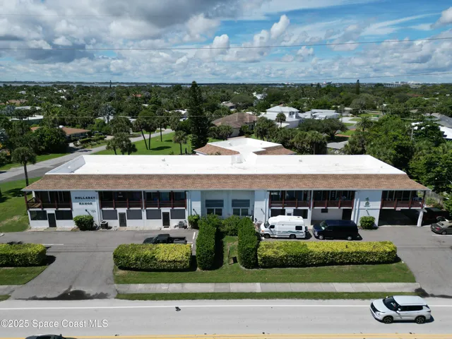 an aerial view of a house with a garden