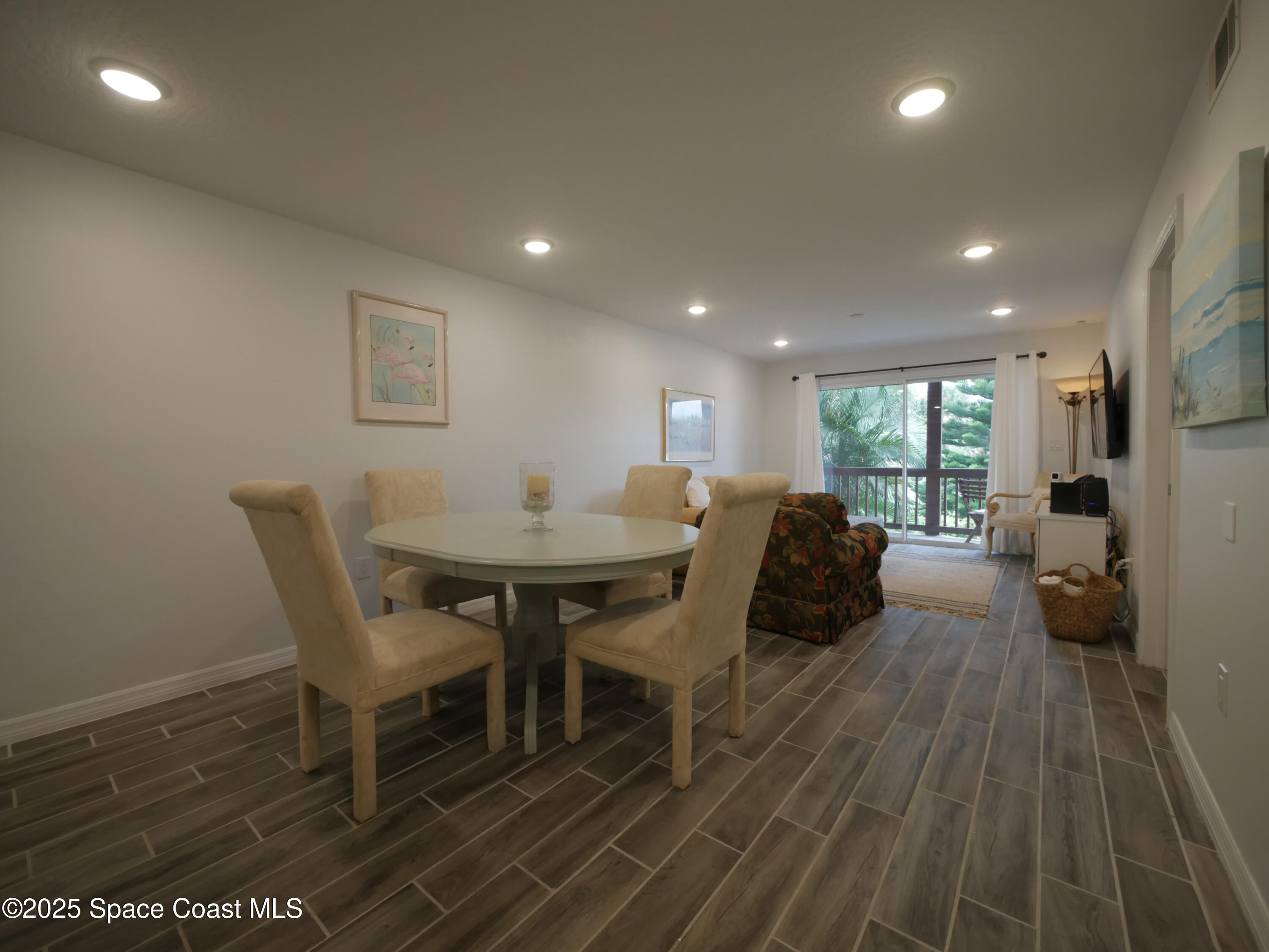 1318 South Miramar Avenue, Unit 208 Indialantic, FL 32903 - Photo 6 of 20 a view of a dining room with furniture