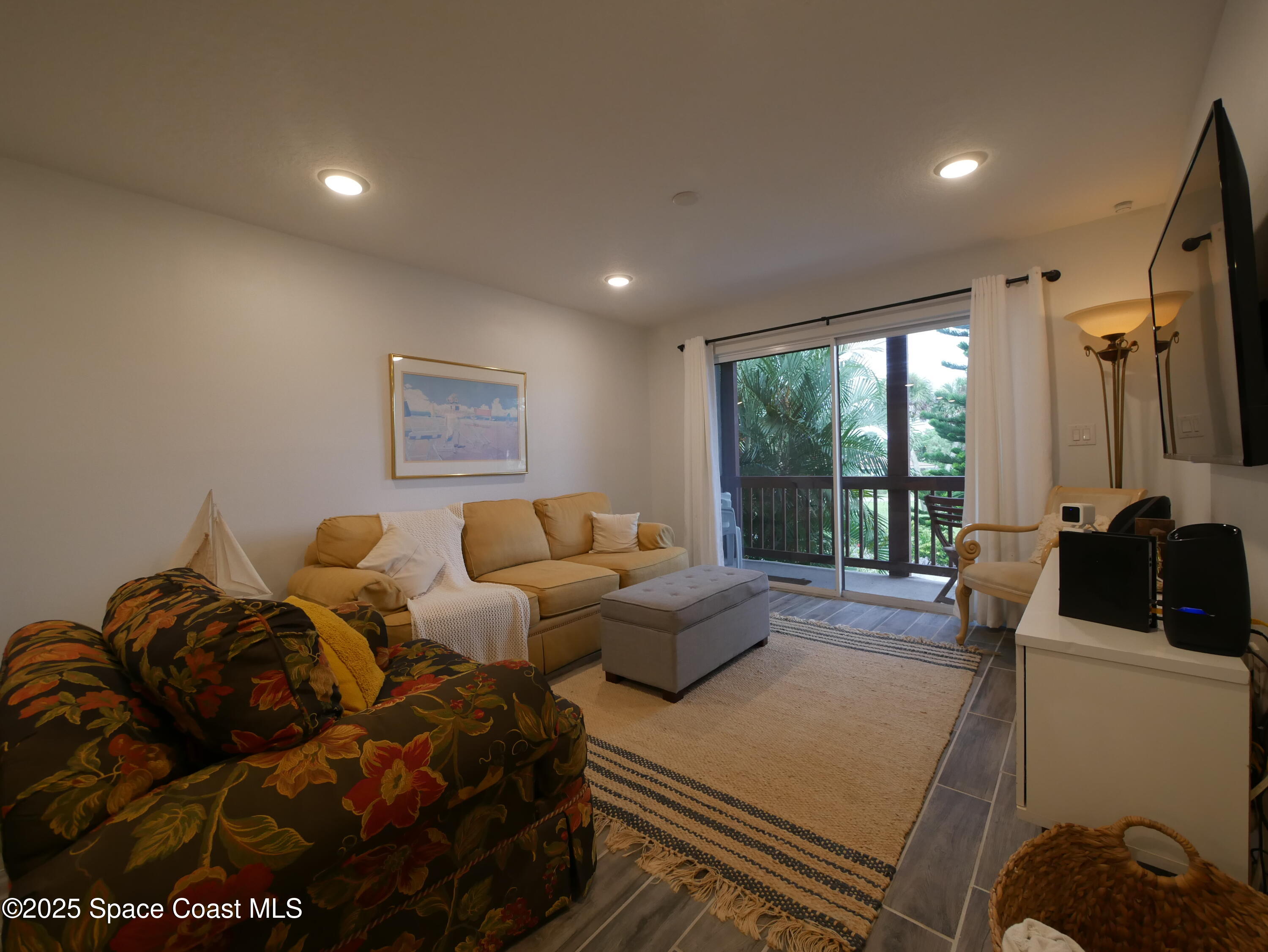 1318 South Miramar Avenue, Unit 208 Indialantic, FL 32903 - Photo 8 of 20 a living room with furniture