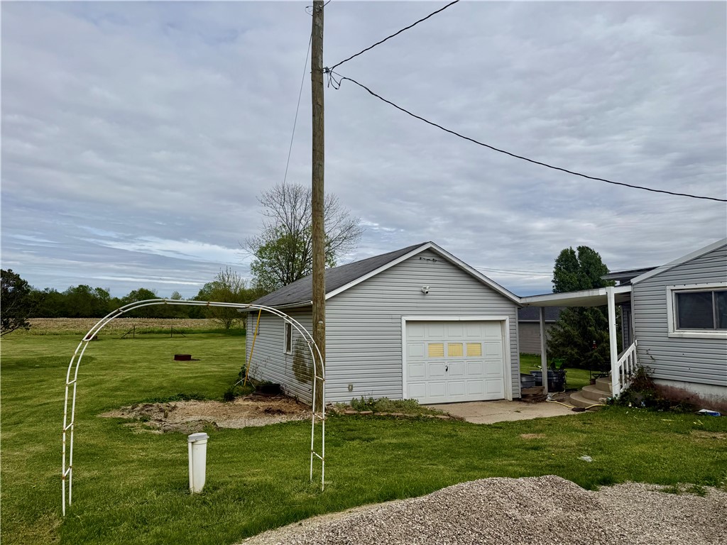 3032 West State Rte 29 Urbana, OH 43078 - Photo 2 of 3 This property features a practical garage and ample outdoor space, perfect for various activities.