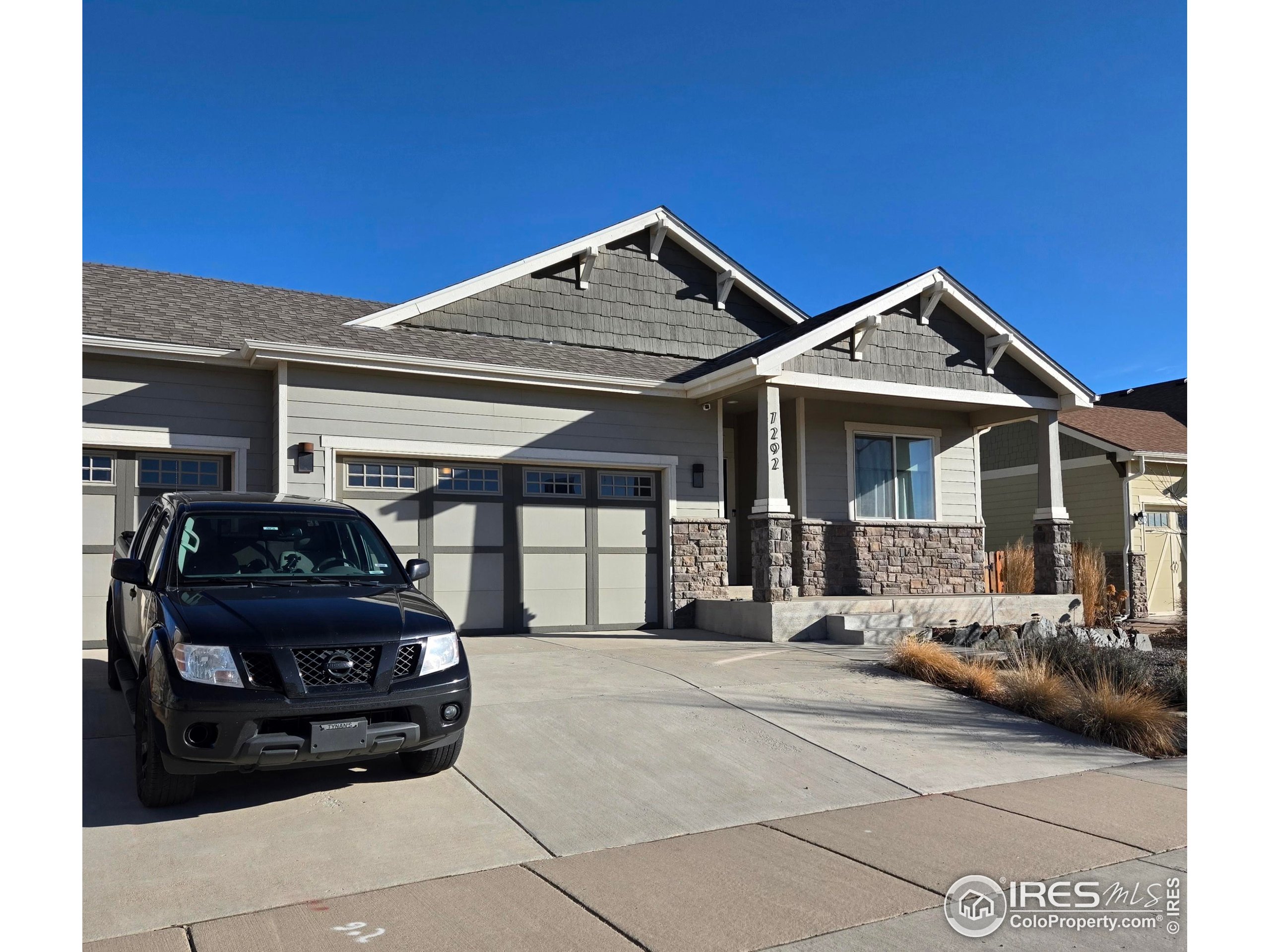 7292 McClellan Road Wellington, CO 80549 - Photo 3 of 19 a front view of a house with parking space