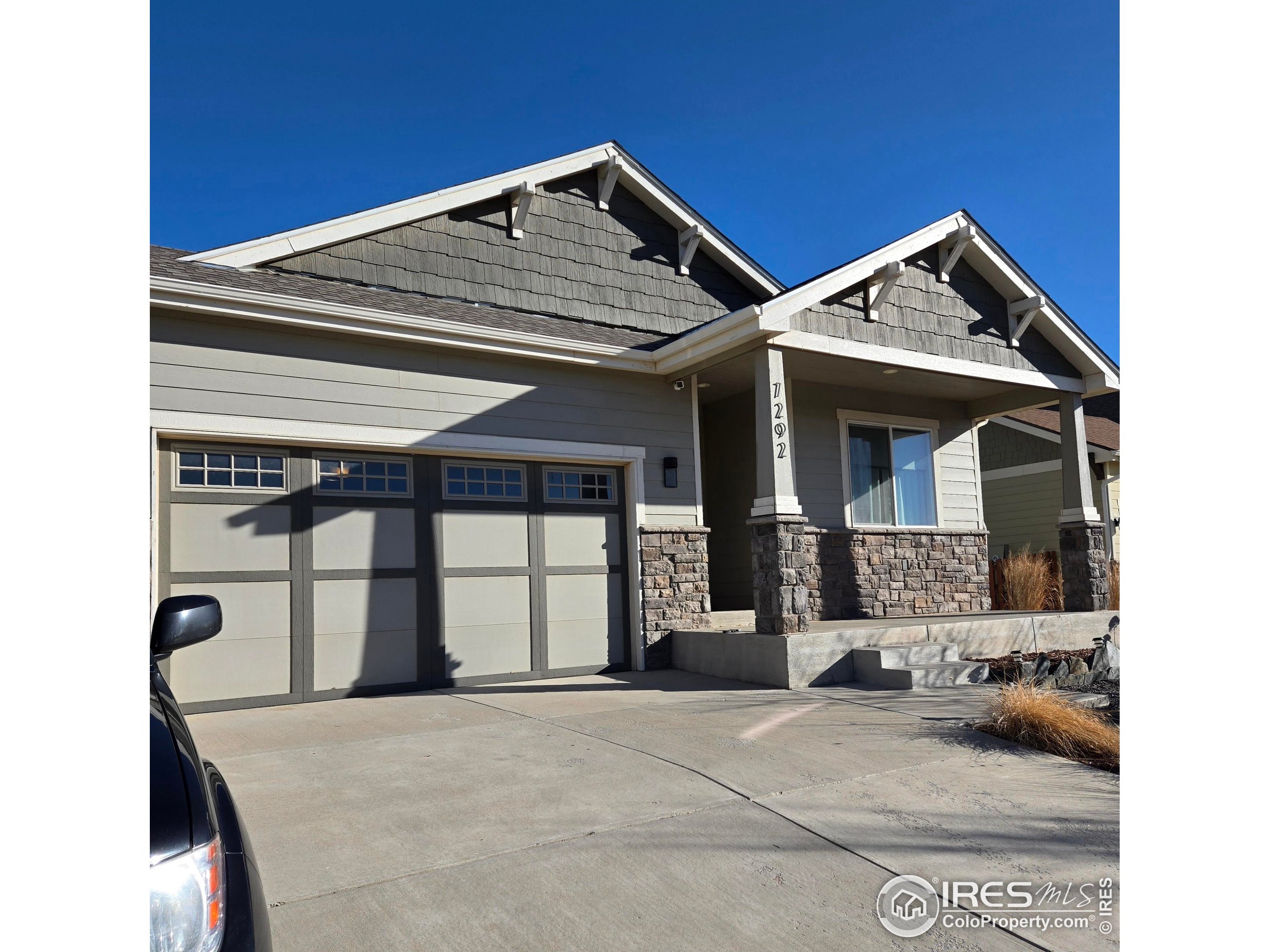 7292 McClellan Road Wellington, CO 80549 - Photo 4 of 19 a view of a house with large windows