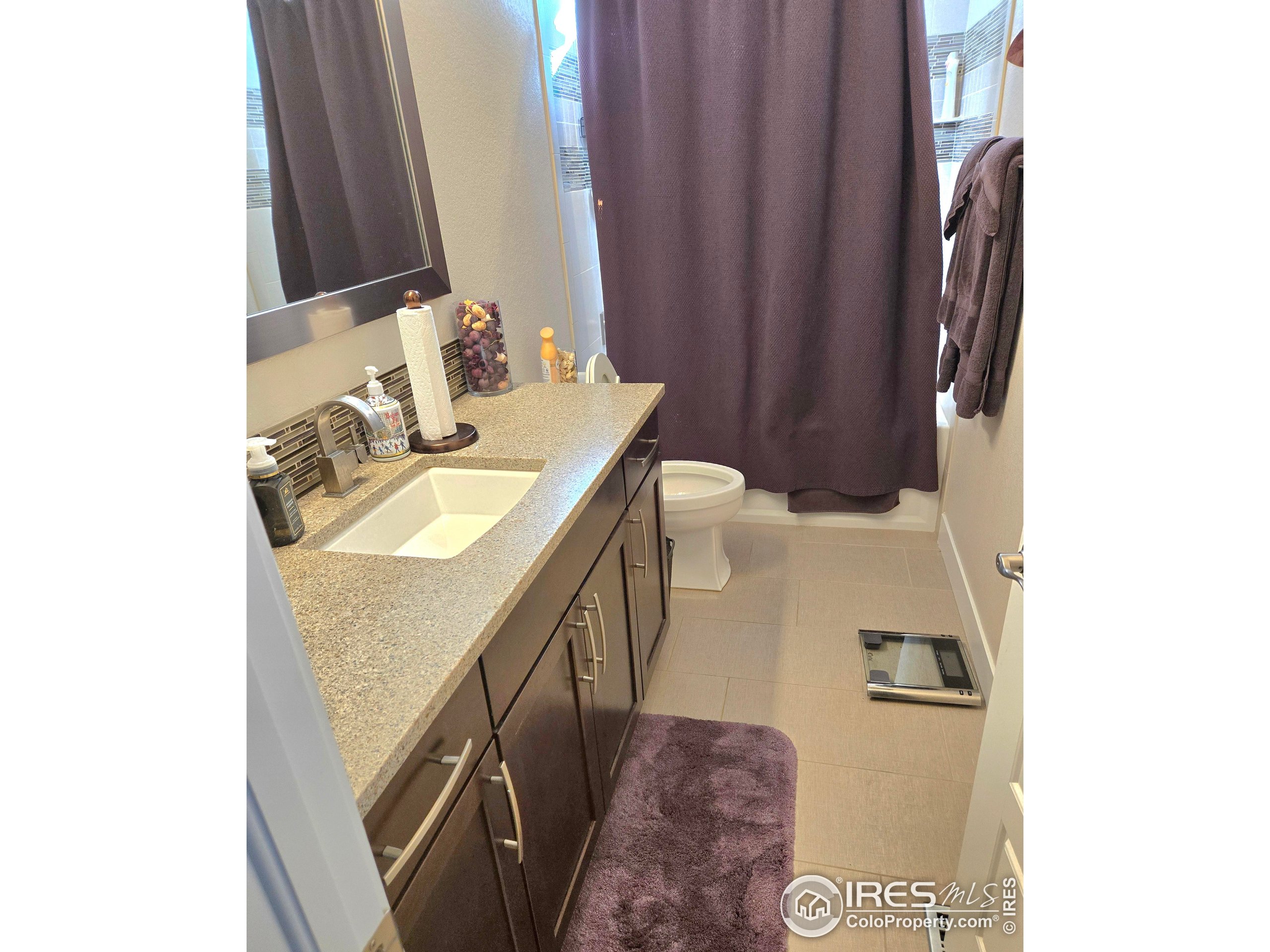 7292 McClellan Road Wellington, CO 80549 - Photo 8 of 19 a bathroom with a sink and a mirror