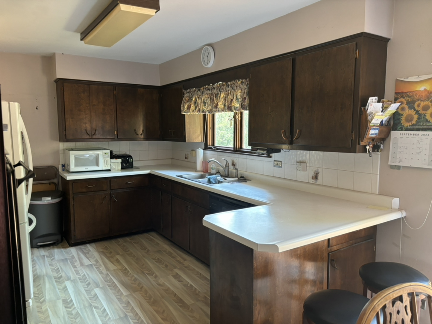 10003 Church Road Barrington Hills, IL 60010 - Photo 9 of 23 a kitchen with a refrigerator and a sink