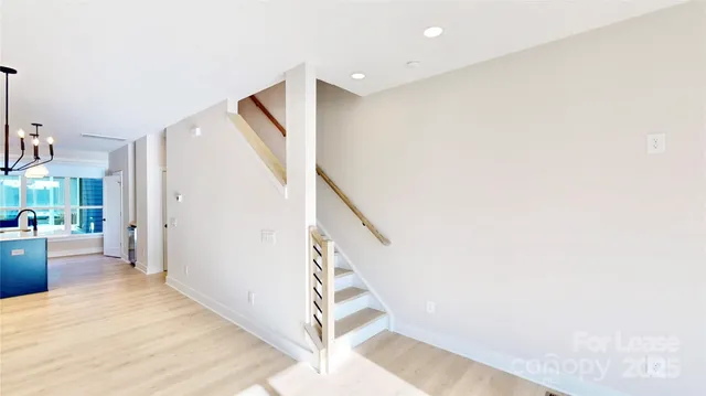 a view of a hallway with staircase