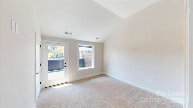 an empty room with large window