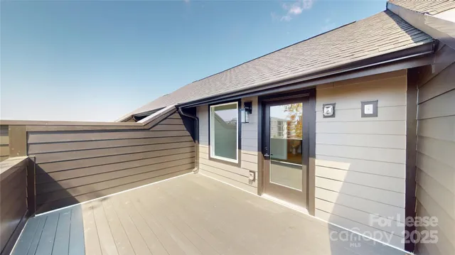 a view of balcony with wooden floor