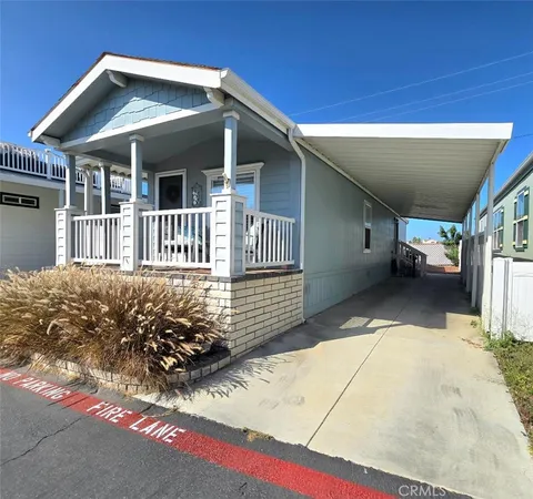 a view of a house with wooden fence