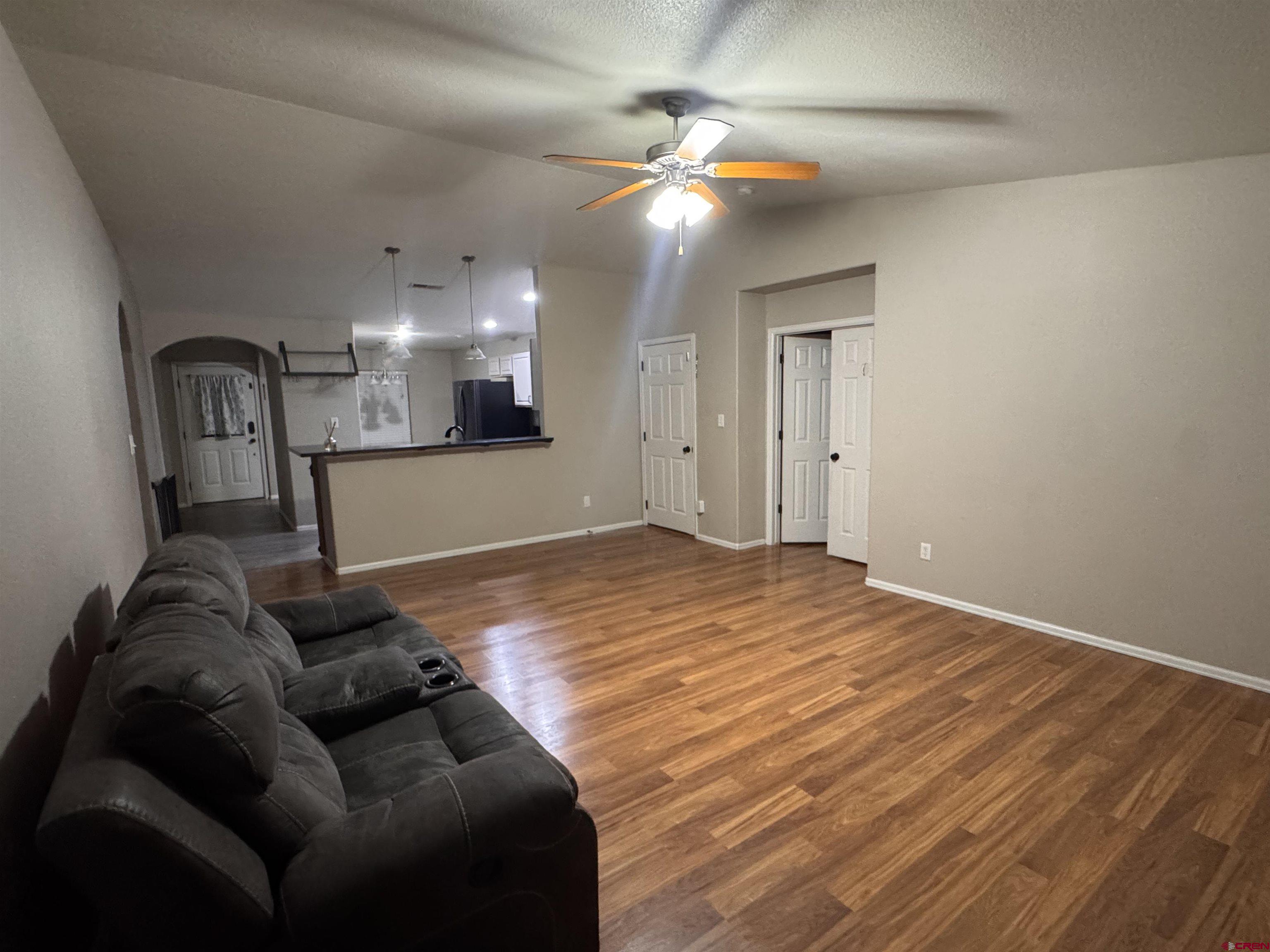 1984 Sapphire Way Delta, CO 81416 - Photo 11 of 22 a living room with furniture and a ceiling fan