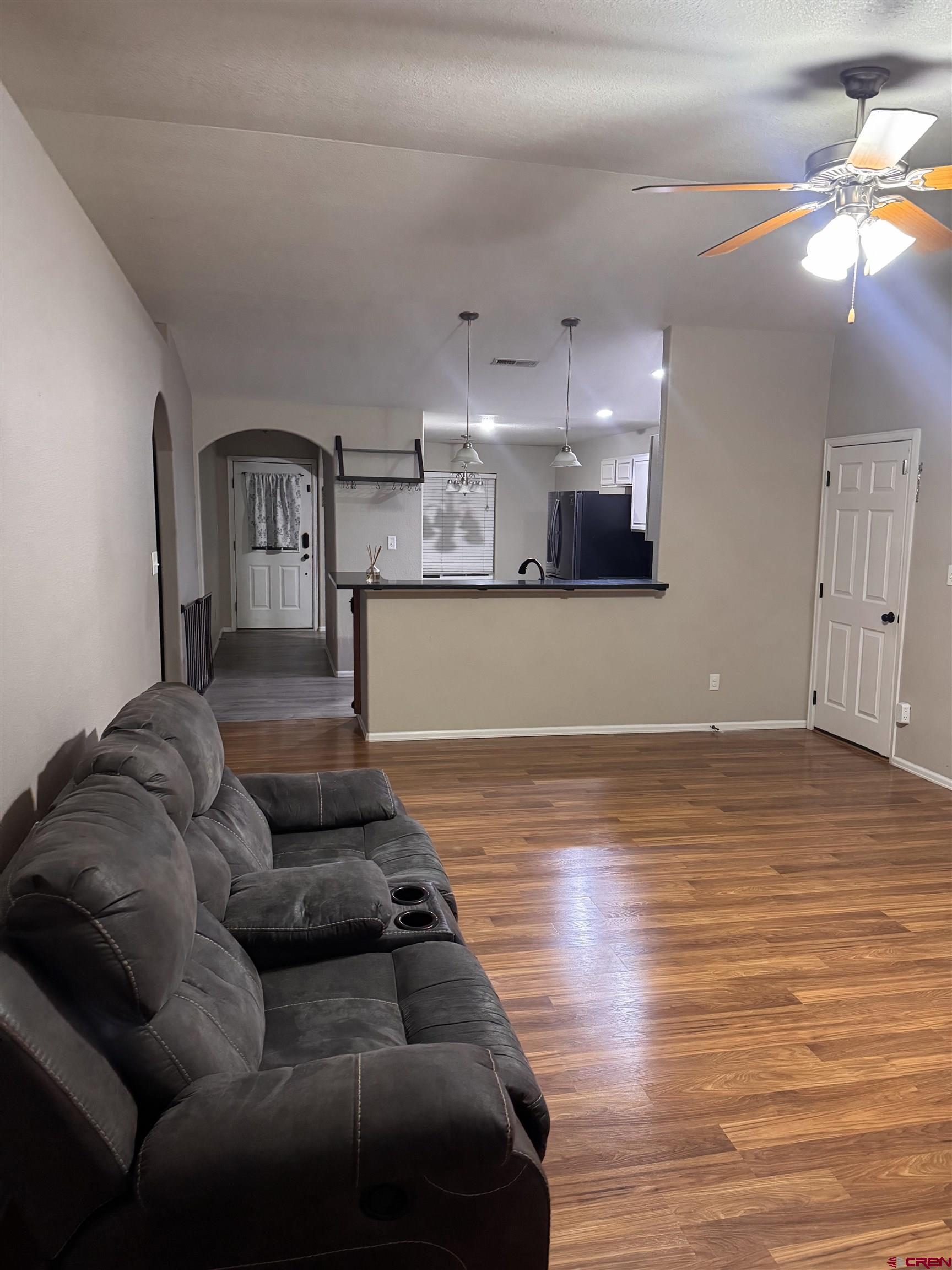 1984 Sapphire Way Delta, CO 81416 - Photo 12 of 22 a living room with furniture and a wooden floor