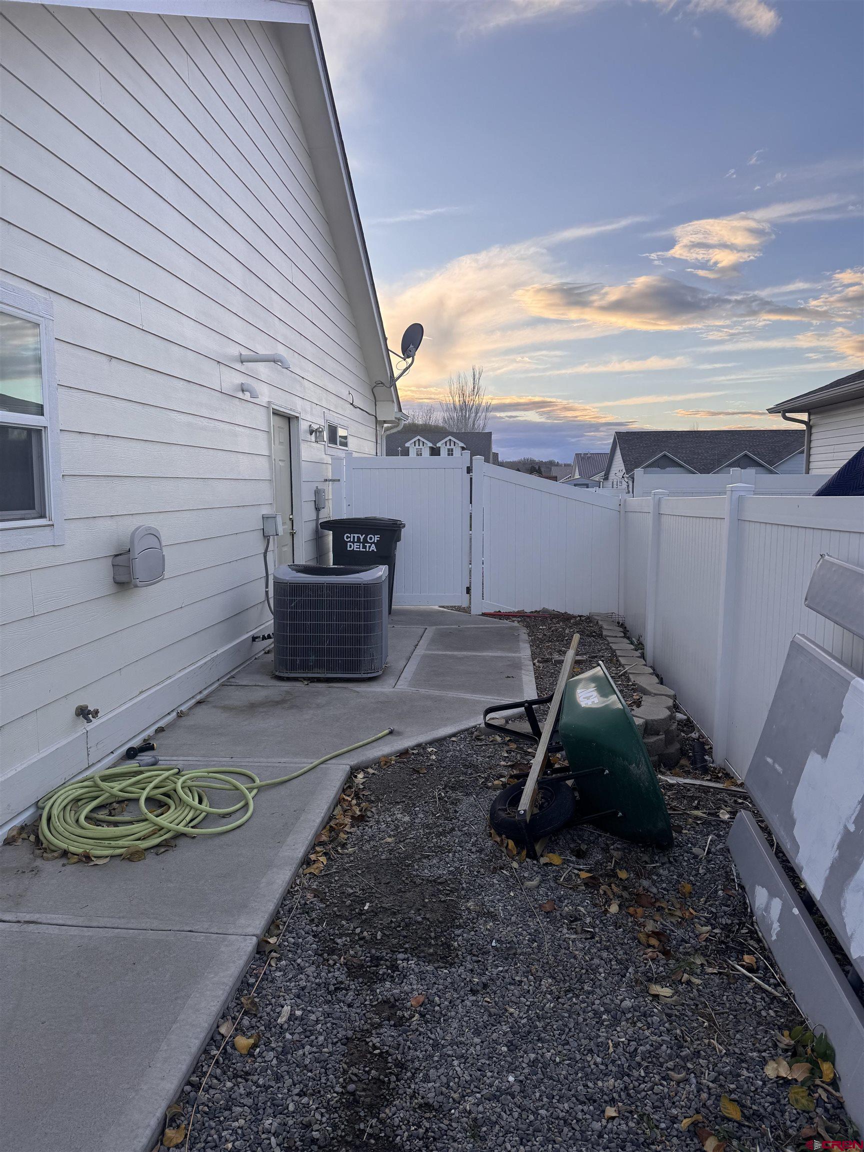 1984 Sapphire Way Delta, CO 81416 - Photo 7 of 22 a view of a backyard with chairs and a grill