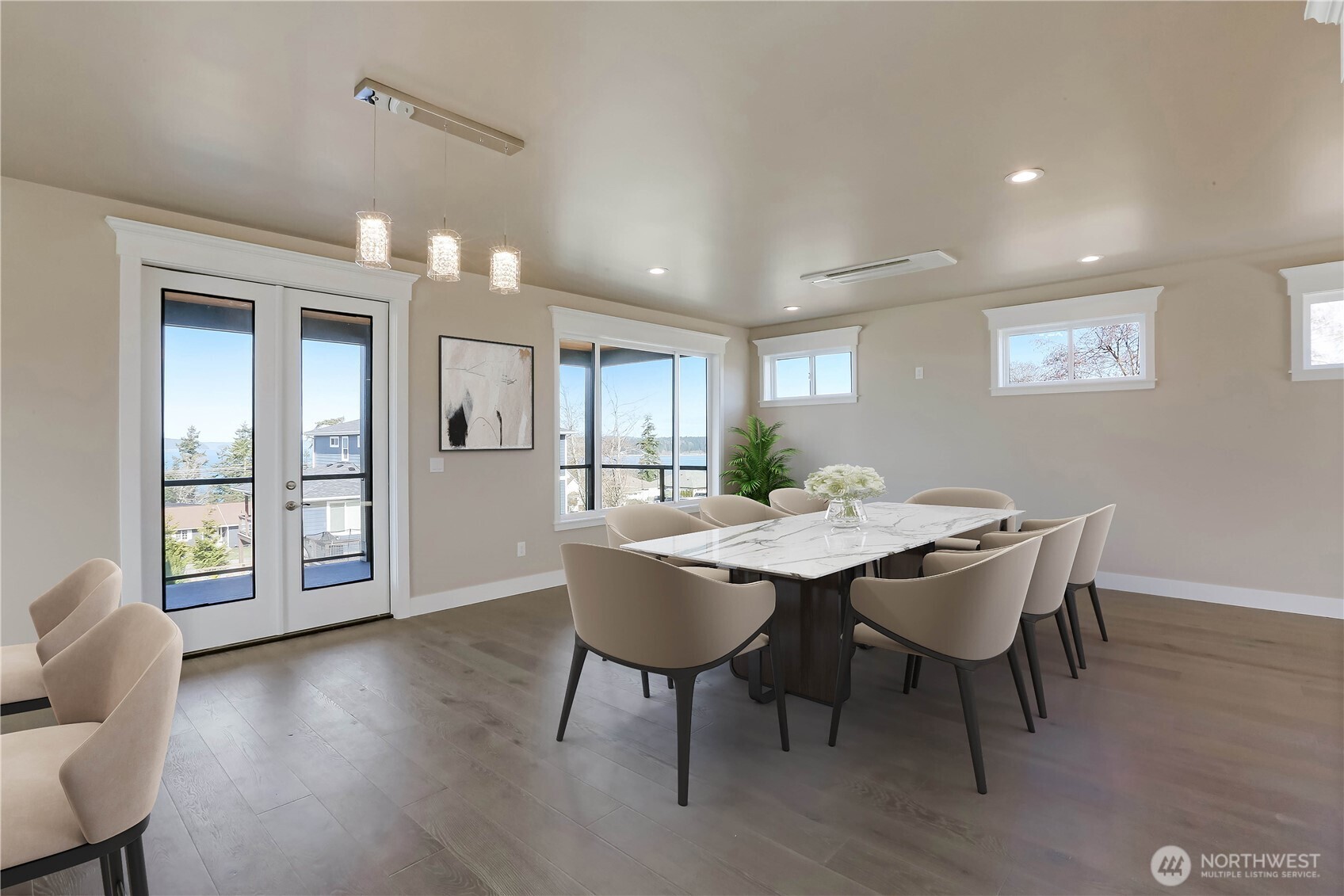 3706 West 3rd Street Anacortes, WA 98221 - Photo 15 of 40 a dining room with furniture and wooden floor