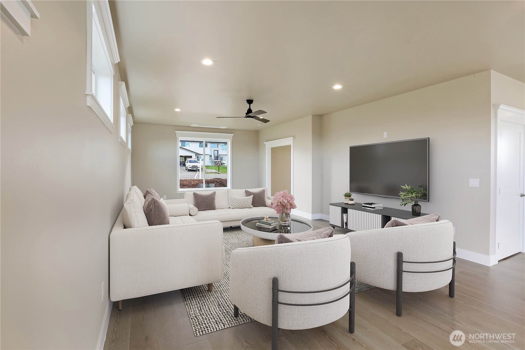 3706 West 3rd Street Anacortes, WA 98221 - Photo 20 of 40 a living room with furniture and a flat screen tv