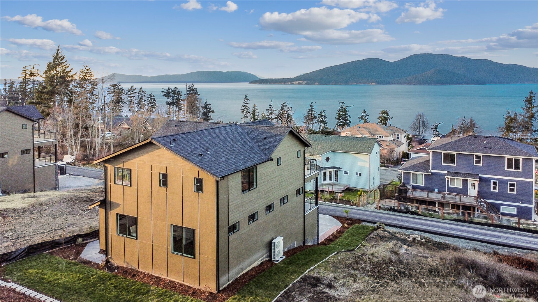 3706 West 3rd Street Anacortes, WA 98221 - Photo 2 of 40 a view of a house with a yard from a balcony