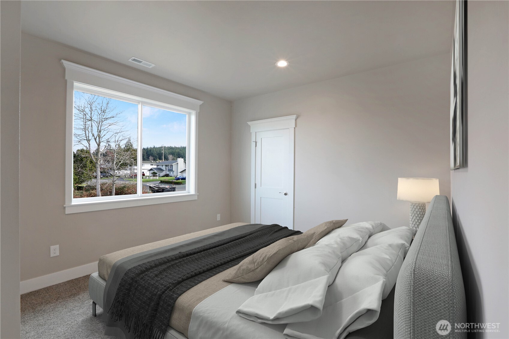 3706 West 3rd Street Anacortes, WA 98221 - Photo 24 of 40 a bedroom with a bed and a window