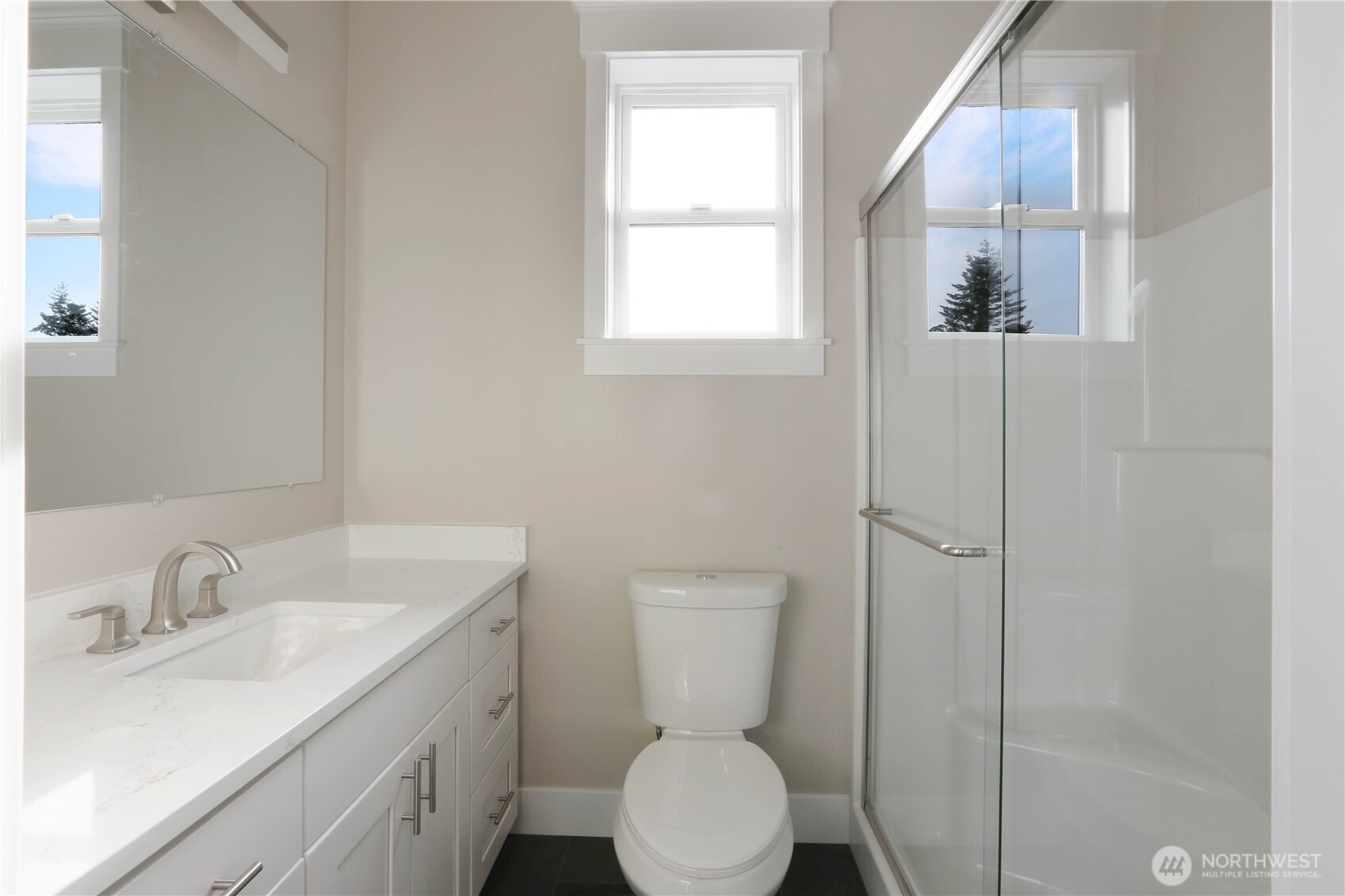 3706 West 3rd Street Anacortes, WA 98221 - Photo 25 of 40 a bathroom with a toilet sink and mirror