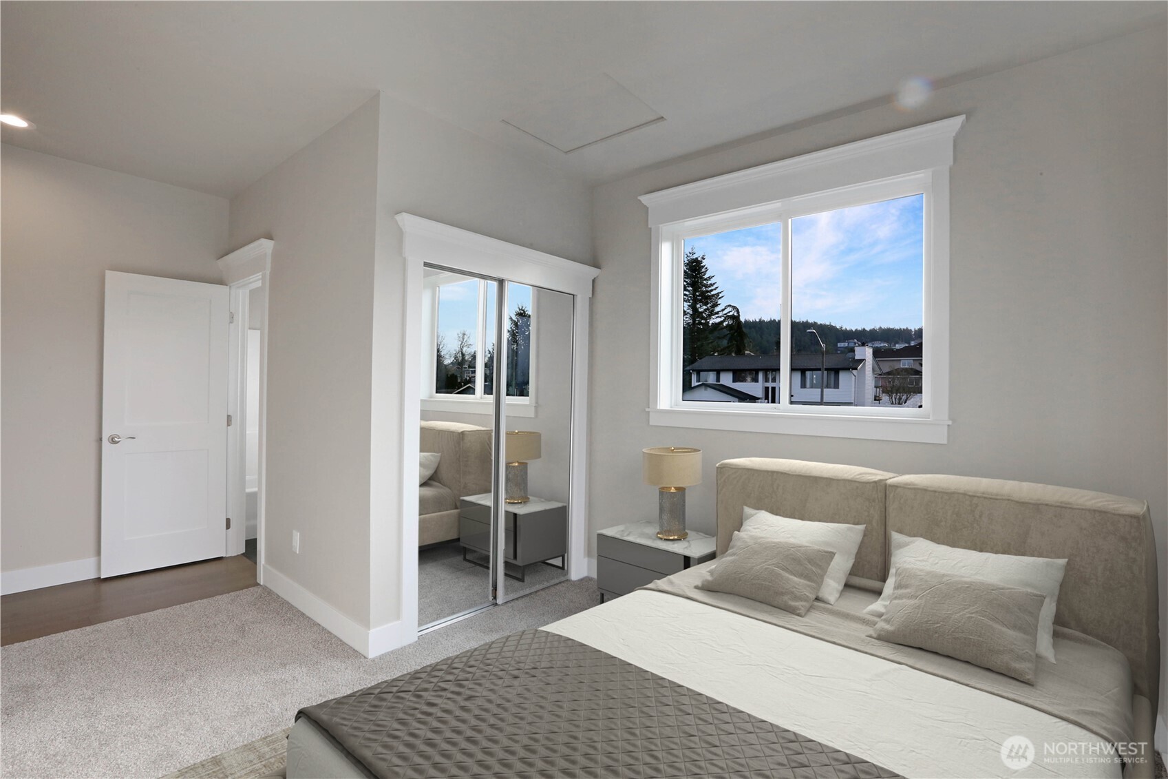 3706 West 3rd Street Anacortes, WA 98221 - Photo 27 of 40 a bedroom with a bed and a window