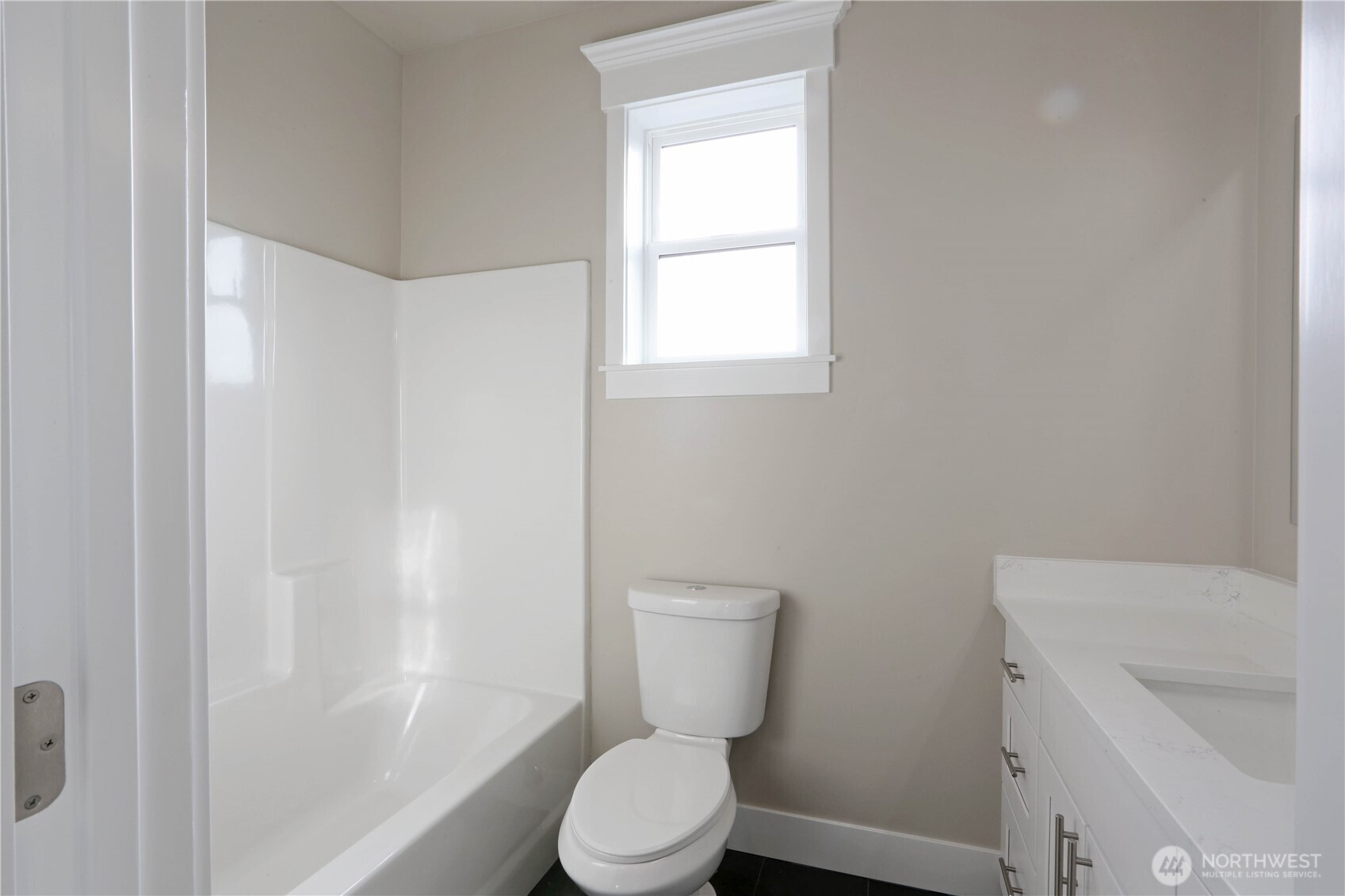 3706 West 3rd Street Anacortes, WA 98221 - Photo 28 of 40 a white toilet sitting next to a bathroom sink