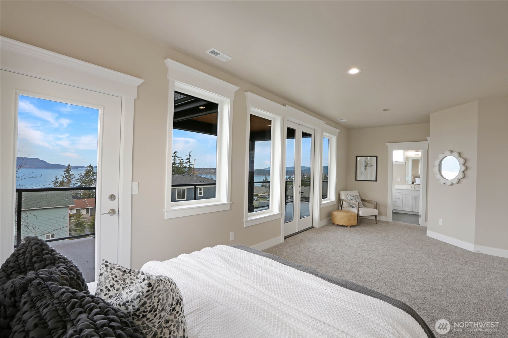 3706 West 3rd Street Anacortes, WA 98221 - Photo 31 of 40 a bedroom with a bed couch and a window