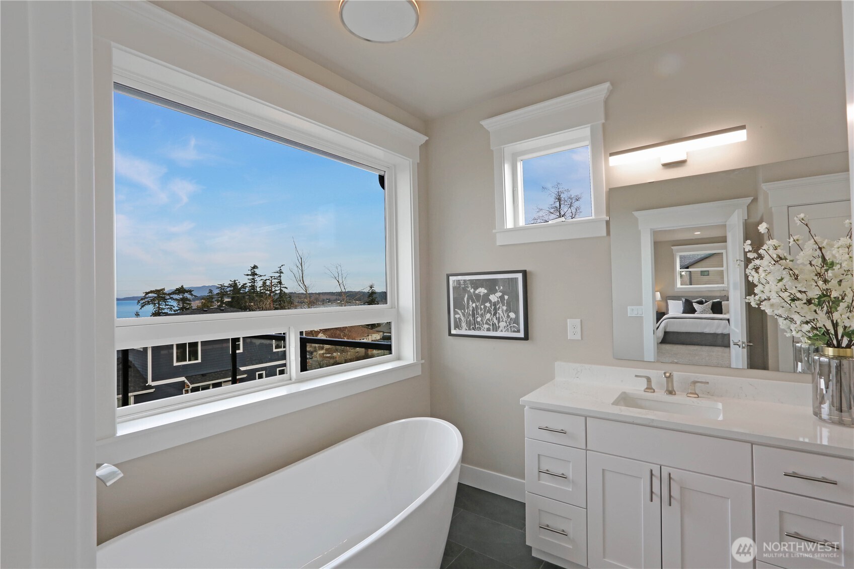 3706 West 3rd Street Anacortes, WA 98221 - Photo 36 of 40 a bathroom with 2 sink toilet and a mirror