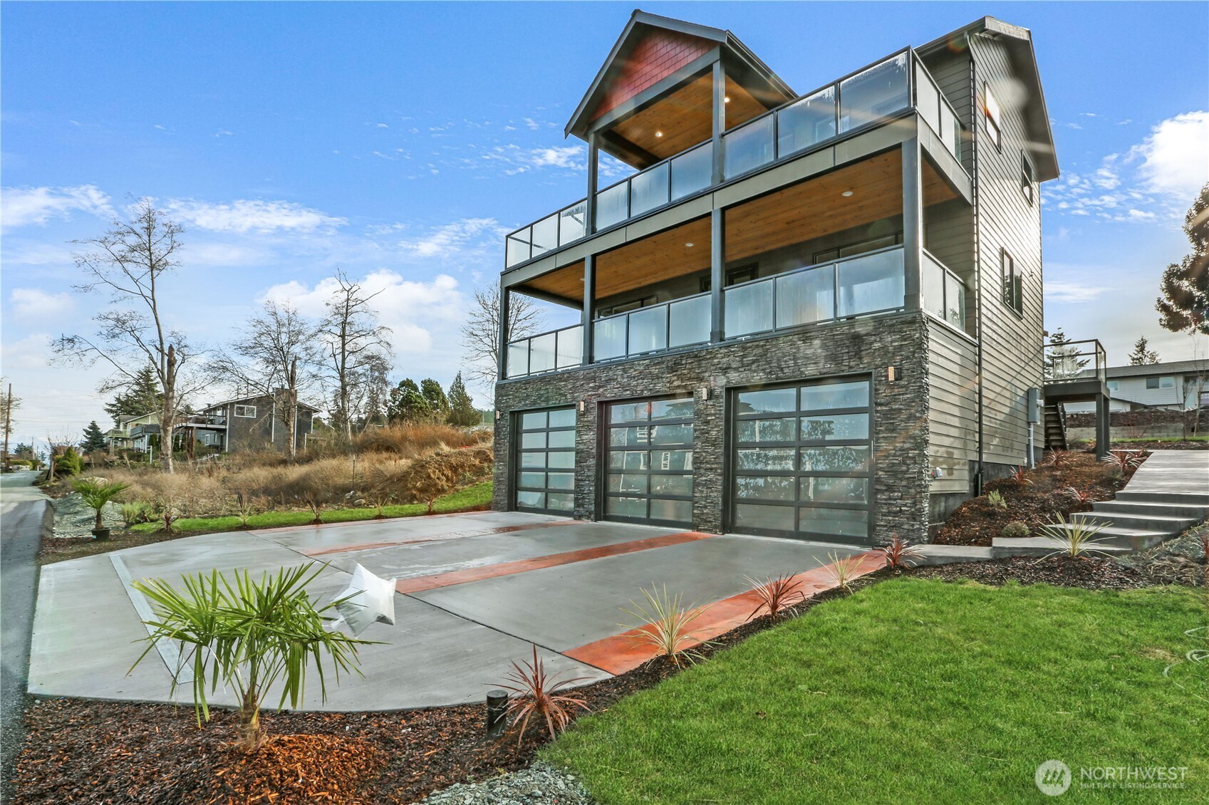 3706 West 3rd Street Anacortes, WA 98221 - Photo 5 of 40 a view of a house with a yard and furniture