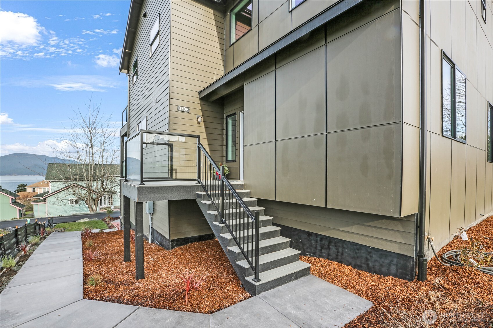 3706 West 3rd Street Anacortes, WA 98221 - Photo 8 of 40 a front view of a house with a yard