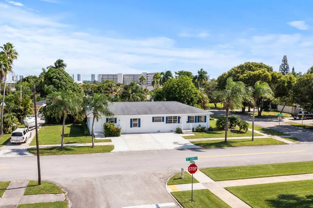 a swimming pool with outdoor seating and yard