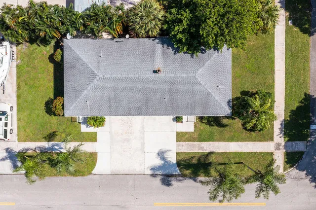 a house with yard and a large parking space