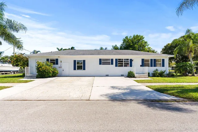 a backyard of a house with seating space