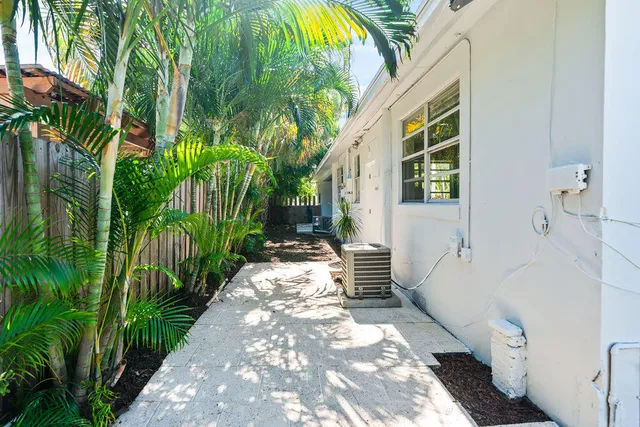 a view of a house with a tree