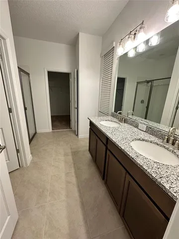 a kitchen with a refrigerator and a microwave