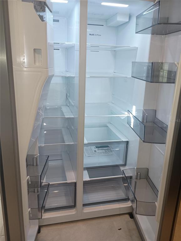 7004 Broad Wing Loop Howey-in-the-Hills, FL 34737 - Photo 10 of 10 a view of walk in closet with empty racks