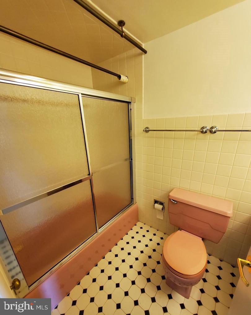 1375 Pershing Boulevard, Unit 810 Reading, PA 19607 - Photo 19 of 21 a bathroom with a toilet and a shower
