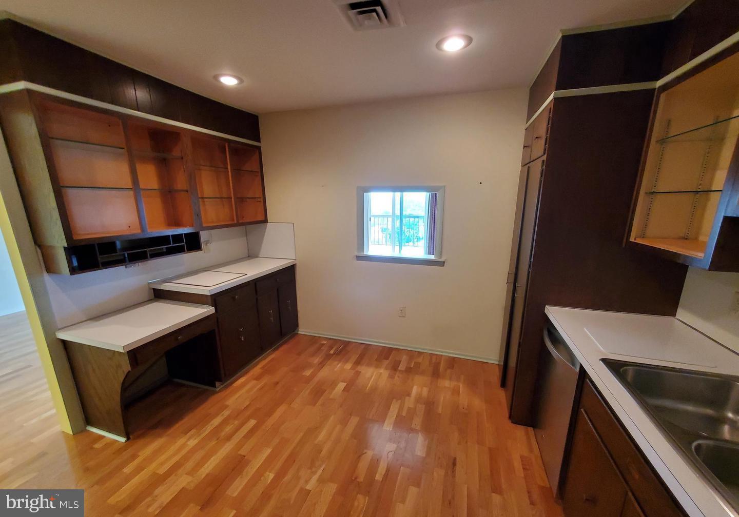 1375 Pershing Boulevard, Unit 810 Reading, PA 19607 - Photo 10 of 21 a view of an empty room with window and wooden floor