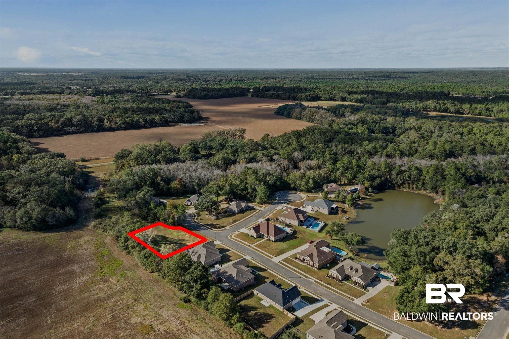 0 Acorn Way Grand Bay, AL 36541 - Photo 11 of 17 Aerial view of property's location with nearby suburban area and property boundaries highlighted