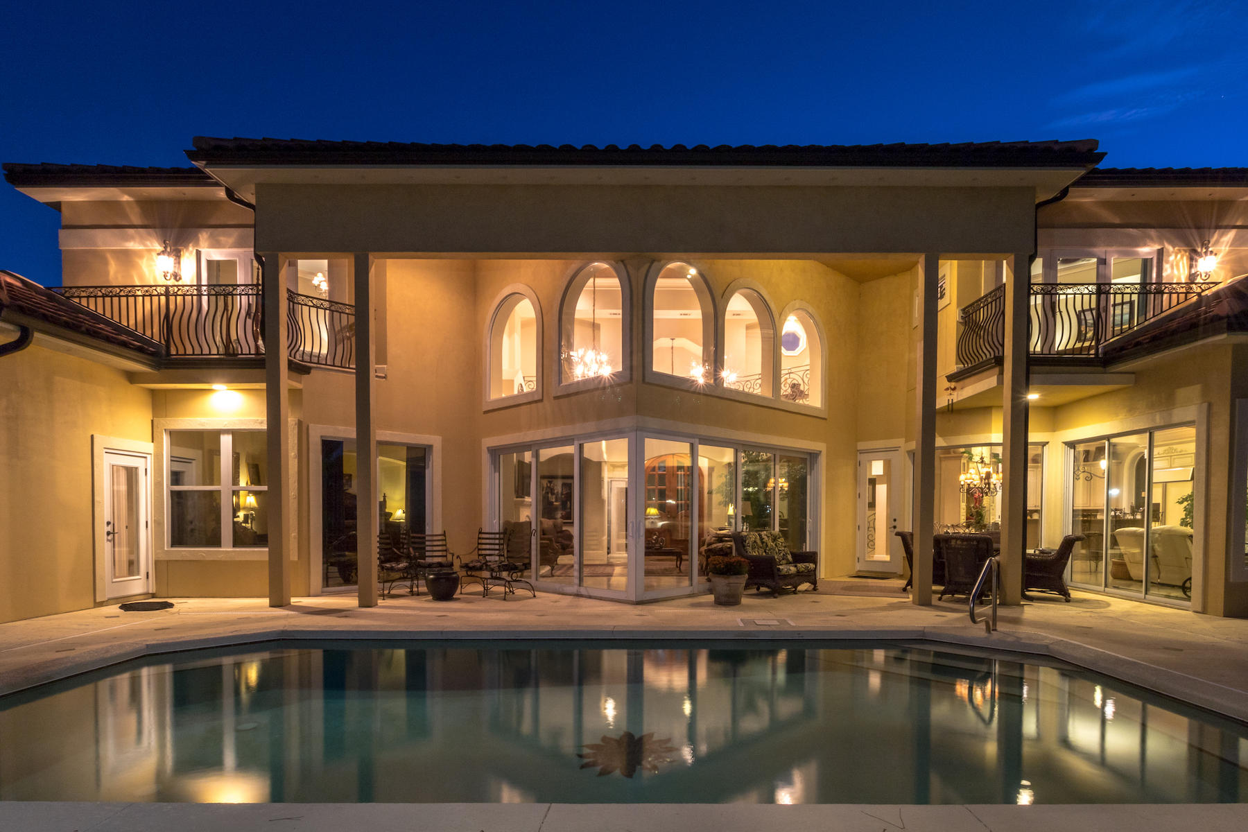 a view of a swimming pool with an outdoor seating
